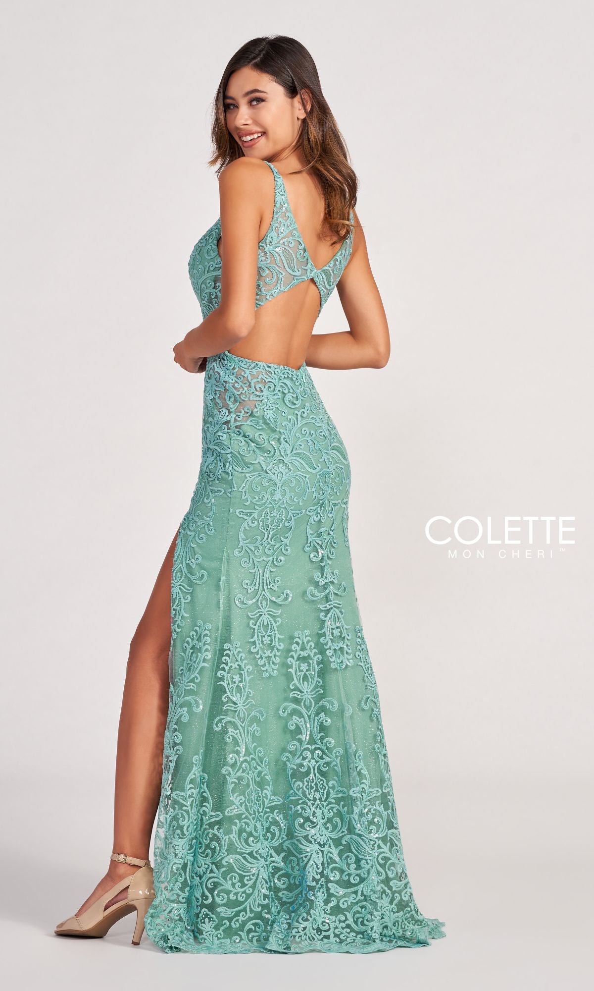 A woman wears the Colette CL2052 Sequin Lace Long Formal Dress—sleeveless, floor-length, seafoam green with a side slit and open back—posing elegantly for prom or any formal evening event.